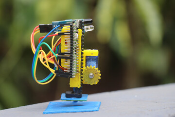 Micro servo with gear and slider mechanism on a 3d printed frame controlled by a micro controller...