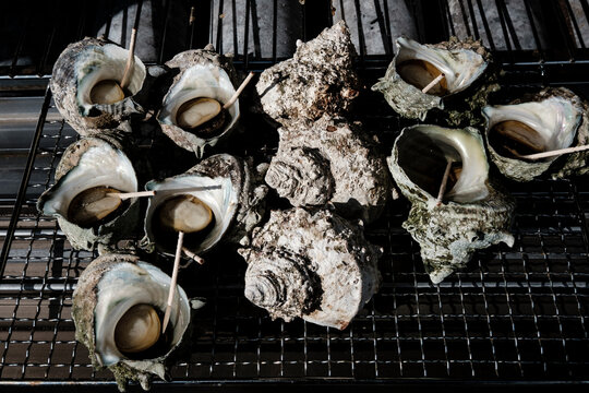 Grilled turban shell street food in Matsushima, Japan.