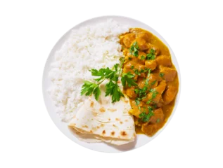 Fototapeten plate of chicken with curry sauce, rice and pita bread isolated on transparent background, top view © Nitr