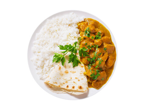 plate of chicken with curry sauce, rice and pita bread isolated on transparent background, top view