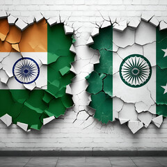 A cracked wall with the Indian flag on one side and the Pakistani flag on the other. Concept of a military conflict between India and Pakistan