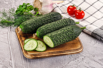 Raw green cucumbers with slices