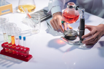 Scientist Conducting Experiment with Laboratory Equipment and Chemicals