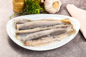 Marinated salted herring fillet apetizer