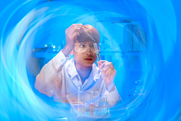 Young Scientist Conducting Experiment in Laboratory with Test Tubes