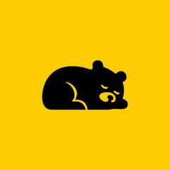 Black bear silhouette, sleeping, on a yellow background