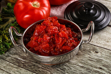 Diced ripe tomato with sauce