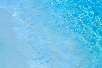 Bright Blue Tropical Sea Water With Sparkling Sunlight Reflections