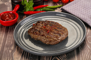 Grilled beef burger cutlet with sauce