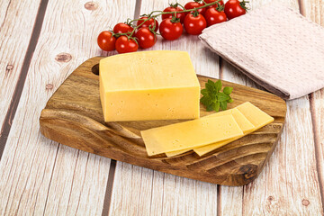 Yellow cheese piece with slices