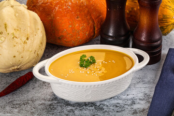 Vegan pumpkin cream soup served sesam