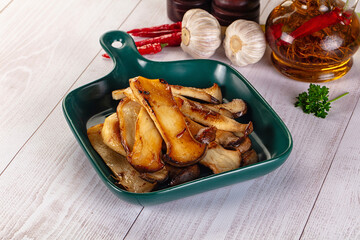 Roasted eringi mushrooms in the plate