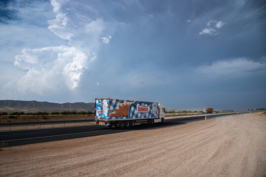 6/18/2025, Jumilla, Murcia; A refrigerated truck labeled with the image of the Bimbo company is traveling on a highway.