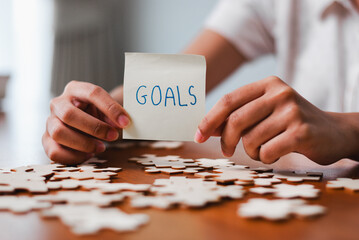Setting personal goals home office inspirational image indoor environment close-up view motivation...