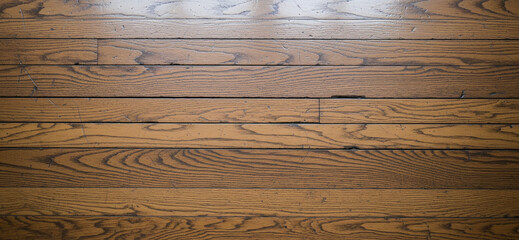 Fototapeta premium Rustic floor design with heavily used planks and surface irregularities framed in a horizontal clean DSLR composition.
