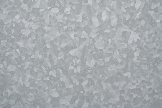 Galvanized Steel Texture: A close-up view captures the intricate pattern of galvanized steel, showcasing its unique crystalline texture in a natural and detailed display.