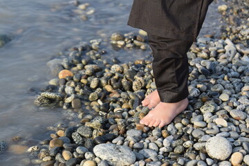 human feet in water, Woman walking on the stones in river, Feet Wading into Clear Creek Water 