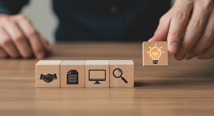 a solution-focused, problem-solving methodology used for innovation and strategic development. Design Thinking Process concept. Wooden blocks with icons; the key stages of the design thinking process