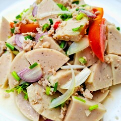 Flavorful Vietnamese Sausage Salad: A vibrant Vietnamese salad bursting with color and flavor. Featuring tender slices of Vietnamese sausage, fresh herbs, savory minced meat.