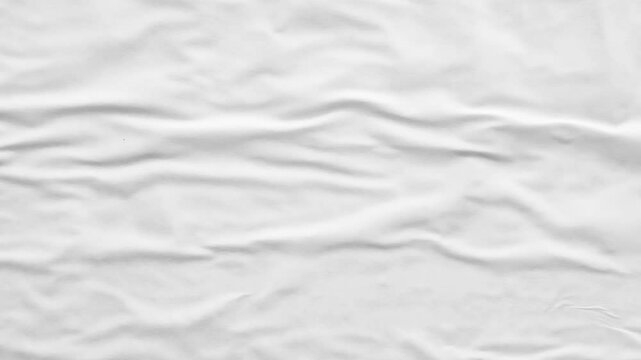 white crumpled and creased glued wrinkled paper poster texture background stop motion