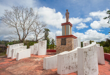 Statue of an indigenous figure at Hatu Udo in Municipal Ainaro, Timor Leste. The monument is a...