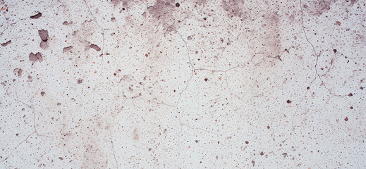 Photorealistic light gray wall with erosion pits and deep cracks providing rugged details for use in texture libraries or motion graphics.