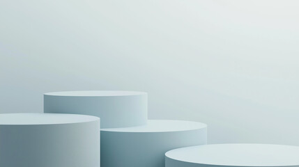  Multiple white cylindrical platforms create tiered display arrangement against soft backdrop
