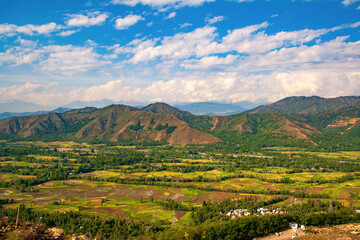 Panoramic Landscape of Kashmir Valley from Titanic Viewpoint after Crossing Jawahar Tunnel &ndash; Lush Green Farmlands and Himalayan Mountains under Blue Sky