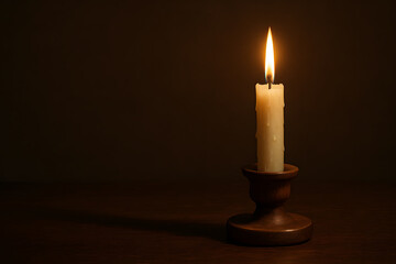Burning Candle in Darkness