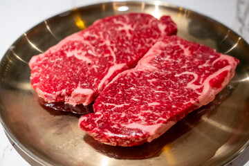 Raw Sirloin Hanwoo Beef, marbled Korean Style Meat prepared on the plate