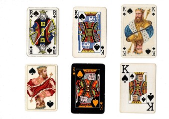 A vintage playing card in different designs isolated on a white background.
