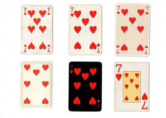 A vintage playing card in different designs isolated on a white background.