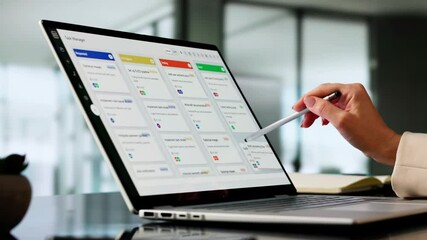 Executive Woman Using Software To Manage Project Agenda