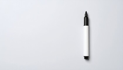 Marker Pen on White: A single black marker on a clean white background with copy space. Concepts: writing, drawing, ideas, office, art.