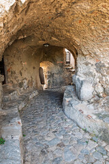 A maze of stone, cobbled, passageways connect the houses in the medieval hilltop village of Sant'Antonino in the Balage region of the Mediterranean island of Corsica