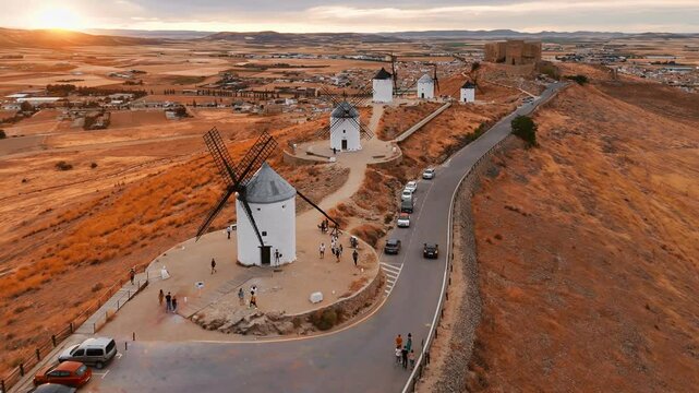 Aerial view of the windmills of Consuegra at sunset, Castilla-La Mancha, Spain.