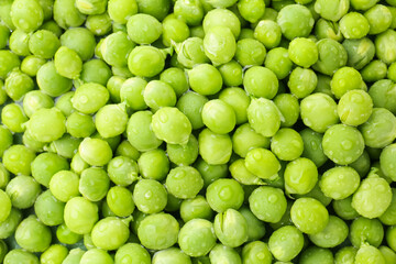 Pile of fresh green peas as background, top view
