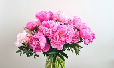 bouquet of peonies. Peony Bouquet isolate. Pink peonies flowers. Large peony flower on a white background. Beautiful pink peony and green. Macro flowers. Bouquet of pink peonies in vase