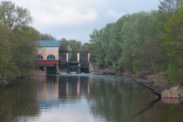 Dam of small hydroelectric power station, water discharge through locks