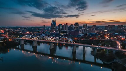 Aerial View of Downtown Nashville Tennessee Skyline Reflecting on Cumberland River at Dusk - Powered by Adobe
