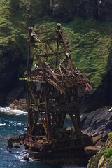 old rusty samson shipwreck with seagulls at ardmore cliffwalk in ireland
