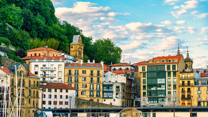 Old buildings next to the small fishing port in the bay of the city of San Sebastian, Guipuzcoa