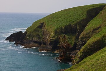 beautiful irish coastline at ardmore cliffwalk in county waterford ireland with shipwreck