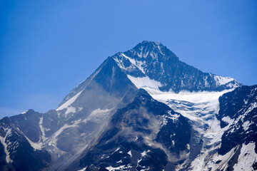 Scenic view of rockfall with dust and gravel snow and glacier at mountain peaks Kleines Nesthorn...