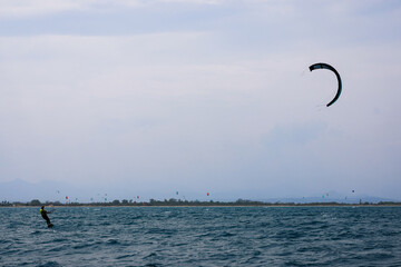 Kitesurfing in Rosas, Costa Brava, Spain, enjoying the mediterranean sea