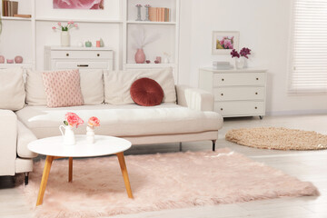 Cozy living room interior. Side table, sofa and dresser indoors