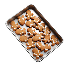 Gingerbread cookies with white icing arranged on a metal baking sheet from an overhead perspective on transparent background