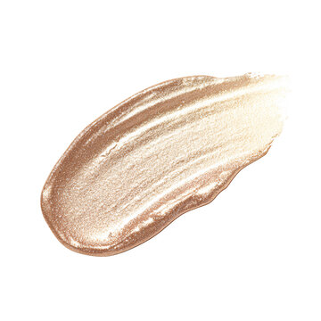 Shimmering gold cosmetic swatch on black background Closeup of luxurious golden cream texture for beauty and makeup product concept
