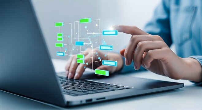 Woman using laptop to manage digital workflow chart