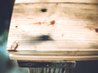 the black self-tapping screw is screwed into the wood